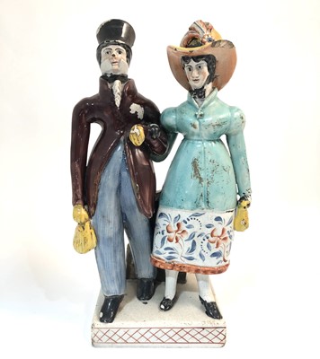 Lot 15 - A Staffordshire pearlware group of Dandies, early 19th century.