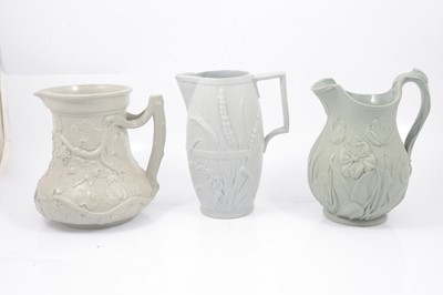 Lot 49 - Stoneware Society of Arts jug, Harvest Barrel jug and a Tulip jug