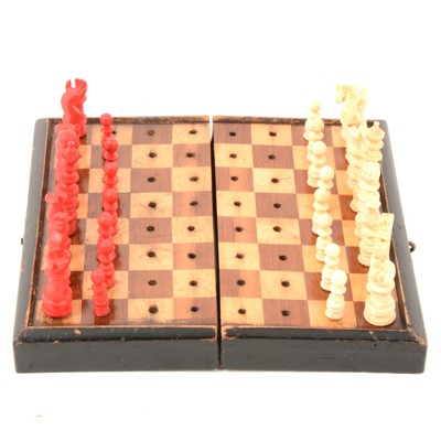 Lot 156 - 19th Century stained bone travel chess set and playing card set.