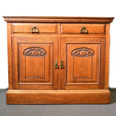 Lot 499 - Art Nouveau oak cupboard.