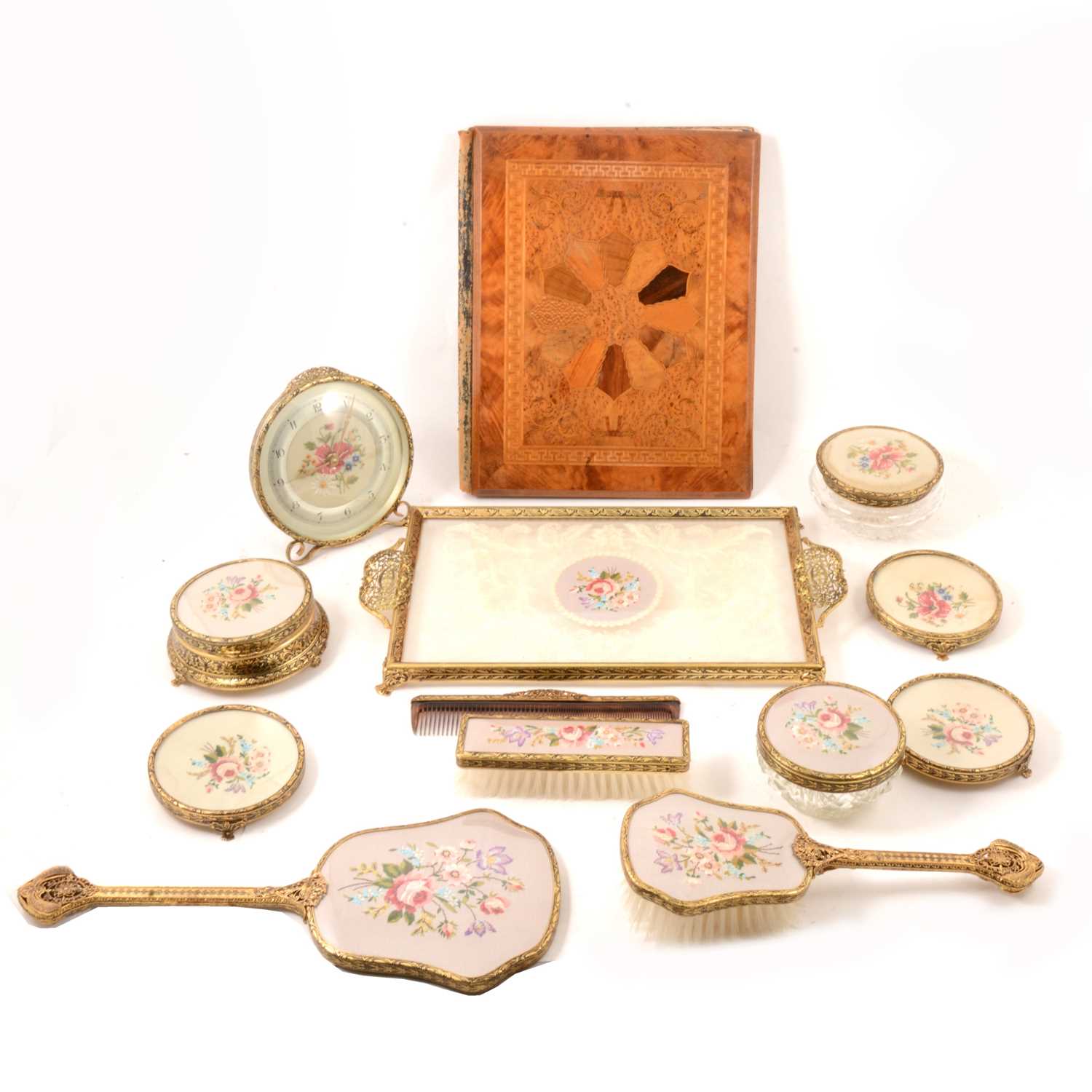 Lot 118 - Victorian specimen marquetry blotter, and a gilt metal dressing table set.