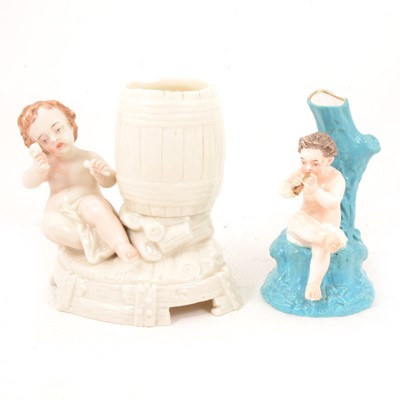 Lot 105 - Two Royal Worcester spill vases with cherubs.