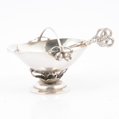 Lot 259 - Danish sterling silver sugar basket and tongs, by Georg Jensen.