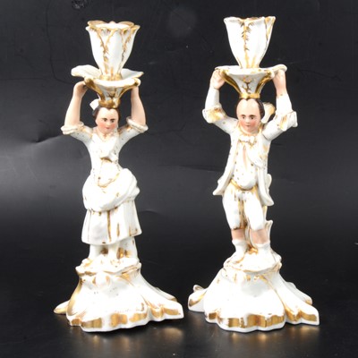 Lot 77 - Pair of porcelain figural candlesticks.