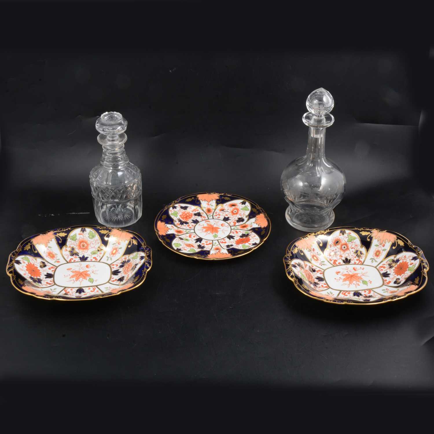 Lot 66 - Royal Crown Derby Imari pattern dishes, plus cut glass decanters.