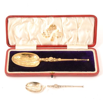 Lot 387 - Silver-gilt anointing spoon by Reid & Sons, London 1910, cased, another silver similar.