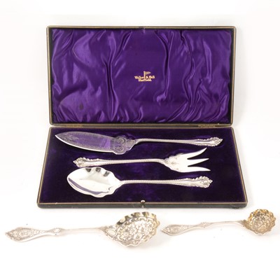 Lot 296 - A cased three piece set of plated fish servers and two ornate silver serving spoons.