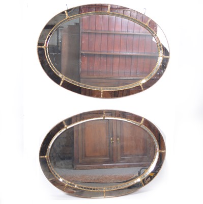 Lot 521 - Suite of six contemporary gilt metal oval mirrors.