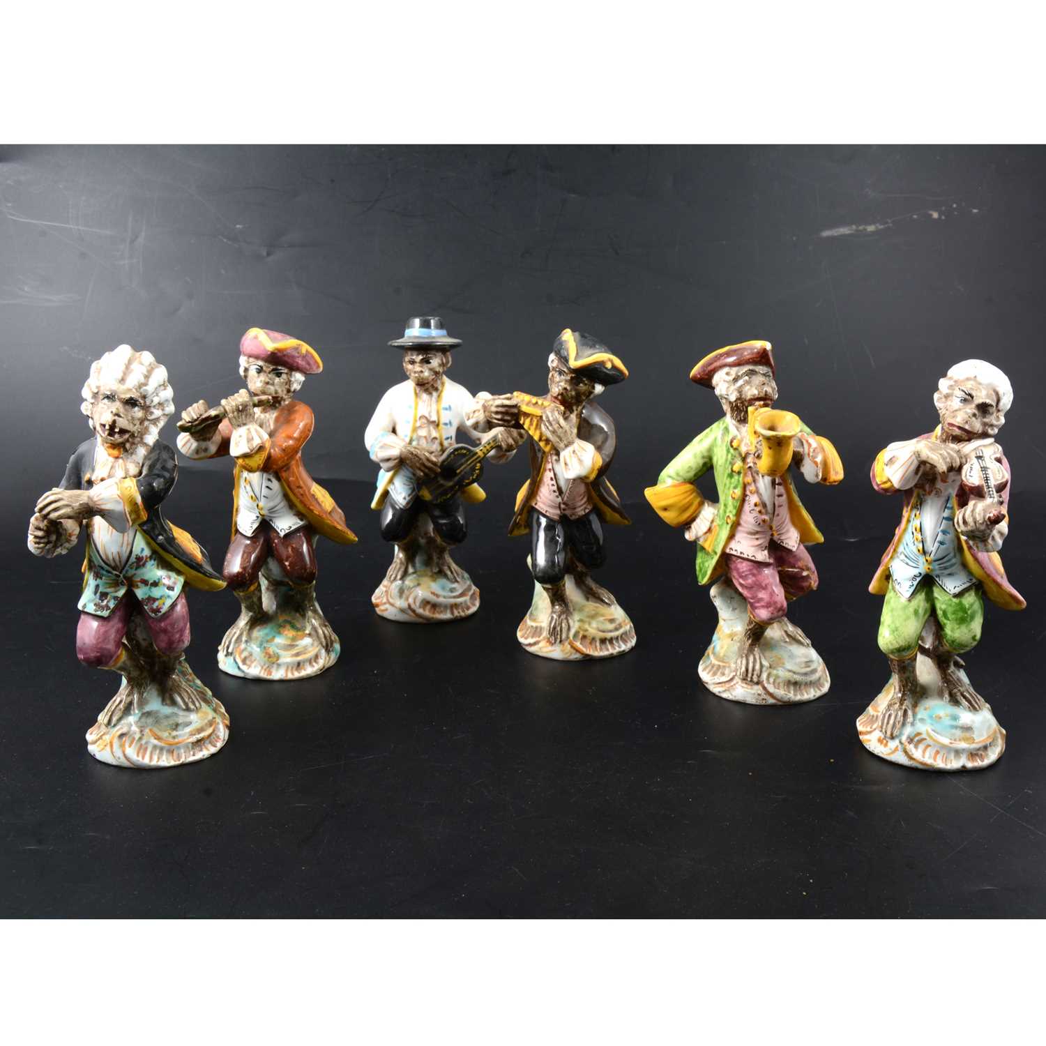 Lot 9 - Set of six Italian majolica Monkey Band figures