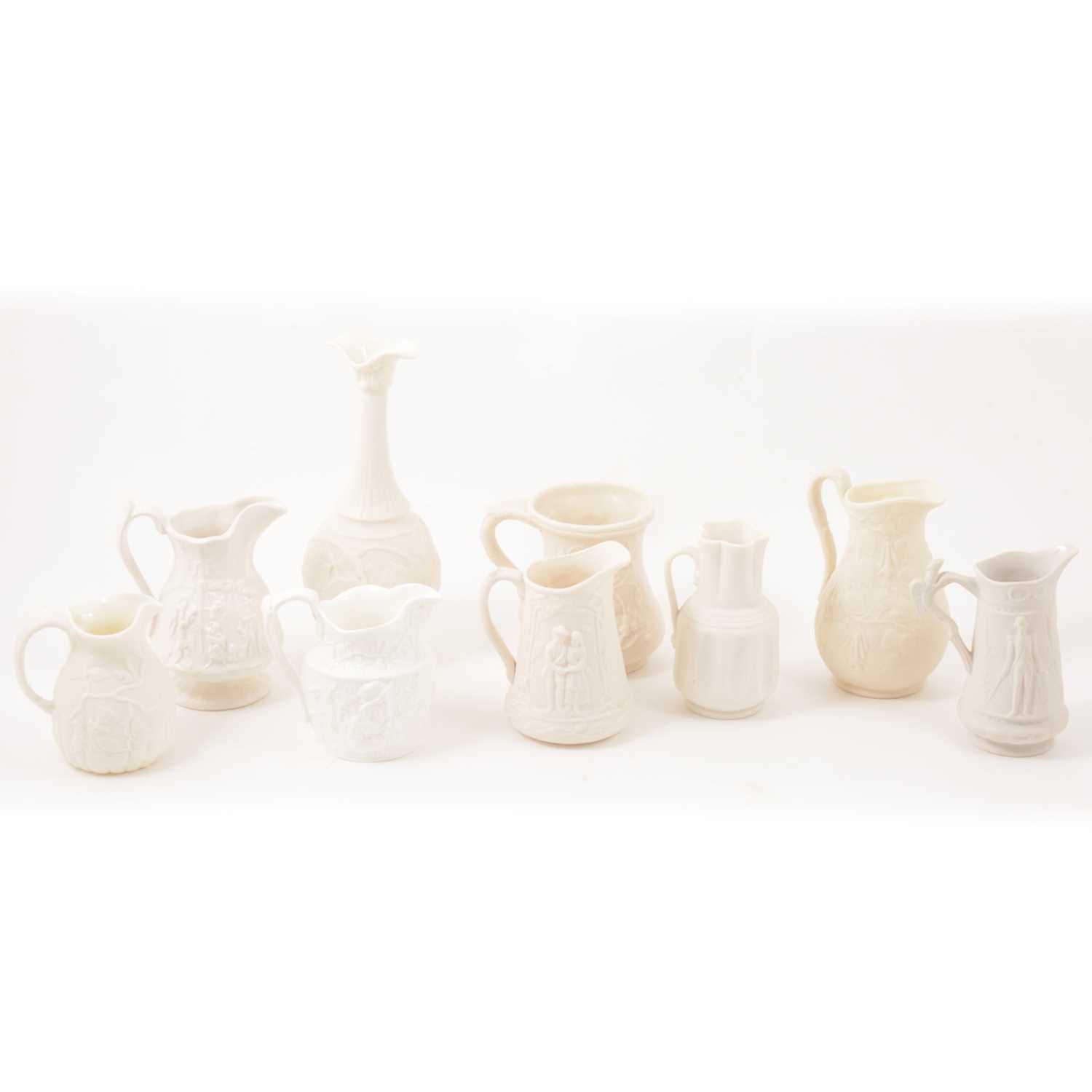 Lot 35 - White pottery jugs and Parian type wares.