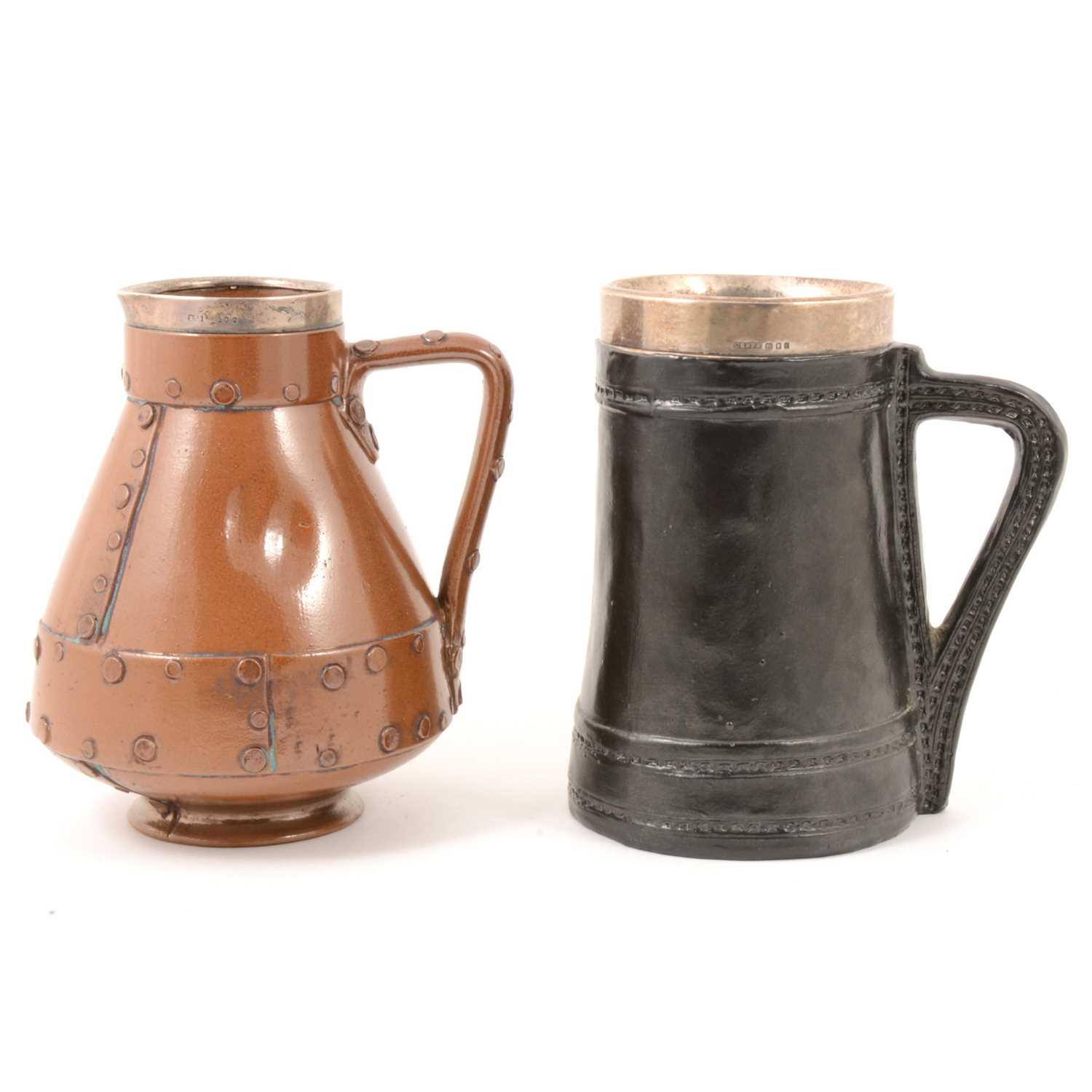 Lot 67 - Doulton Lambeth silicon stoneware 'riveted copper' jug, and another 'Black Jack' jug.