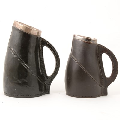 Lot 68 - Two similar Doulton Lambeth stoneware 'black jack' jugs with silver mounts