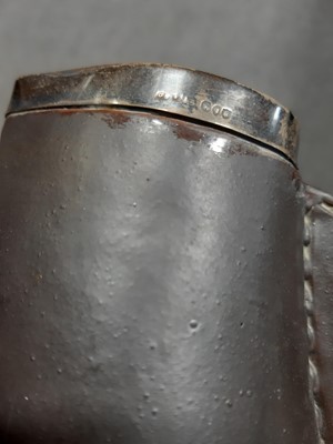 Lot 68 - Two similar Doulton Lambeth stoneware 'black jack' jugs with silver mounts