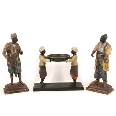 Lot 191 - Pair of patinated North African street vendors, and a similar figural dish.
