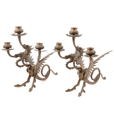 Lot 265 - Pair of neo-Gothic bronze three-headed griffin candlesticks.