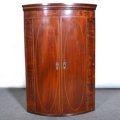 Lot 564 - George III inlaid mahogany cylinder front hanging corner cupboard