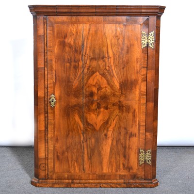 Lot 544 - Small walnut hanging corner cupboard