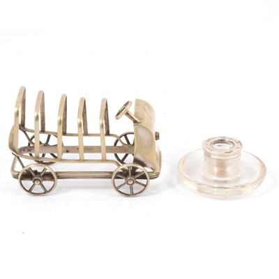 Lot 251 - Novelty silver-plated toast rack and a match striker