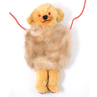 Lot 338 - A Merrythought 'Cheeky Bear' muff with strap, 36cm in length.