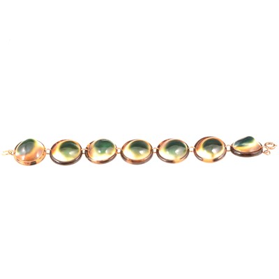 Lot 310 - Bracelet set with Operculum shells in tortoiseshell effect surround and back.