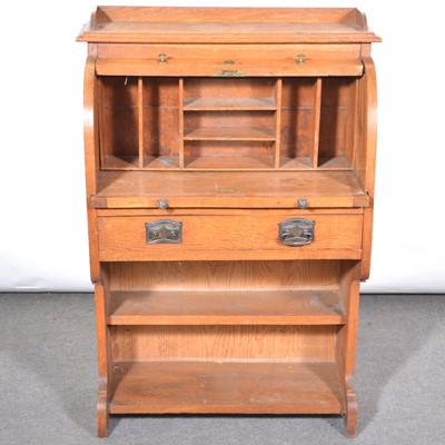 Lot 406 - A small oak cylinder top desk