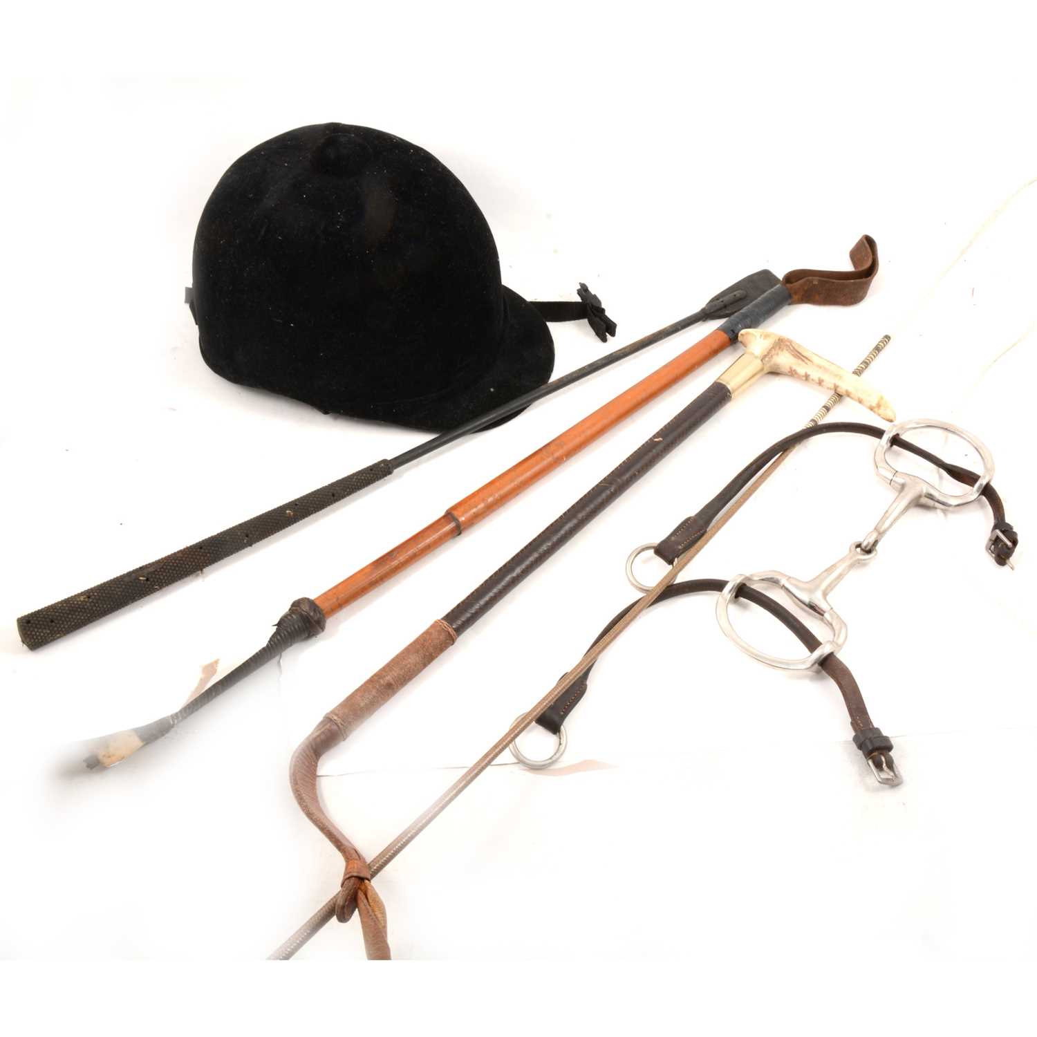 Lot 196 Five riding crops, leather saddle, other