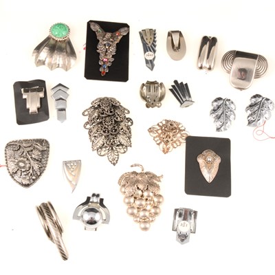 Lot 319 - Twenty-one Art Deco silver tone dress clips.