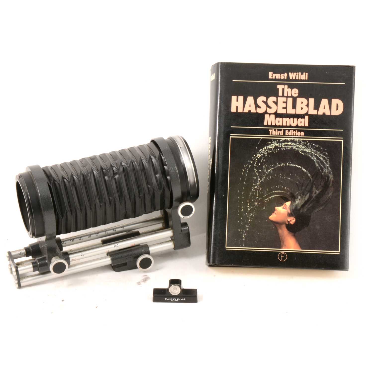 Lot 33 - Pair of Hasselblad medium bellows, level and book.