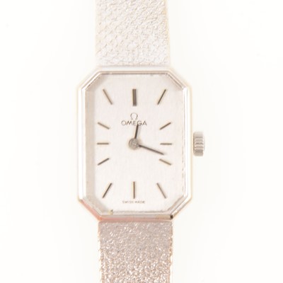 Lot 264 - Omega - a lady's 18 carat white gold bracelet watch.
