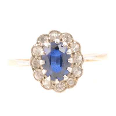 Lot 288 - Oval cluster ring set with synthetic blue and white stones.