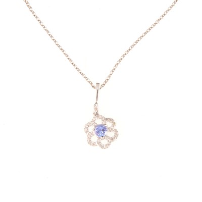 Lot 313 - A tanzanite and diamond pendant and chain