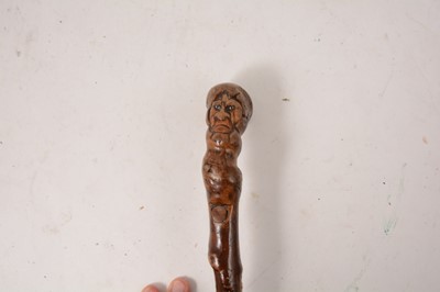 Lot 238 - Folk Art yew wood walking stick, carved with a face.