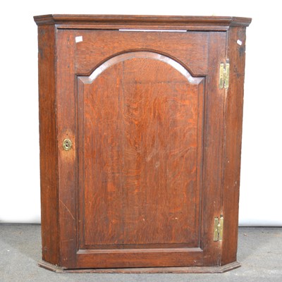 Lot 408 - George III oak hanging corner cupboard.