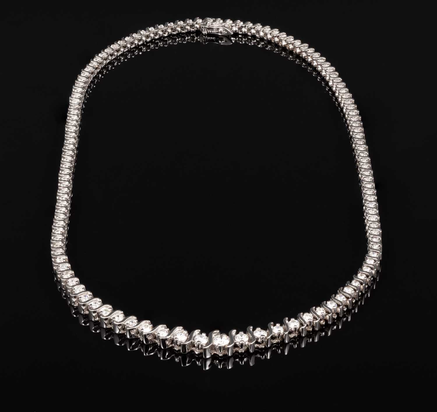 Lot 263 - A diamond necklace set with one hundred and twenty-one diamonds.