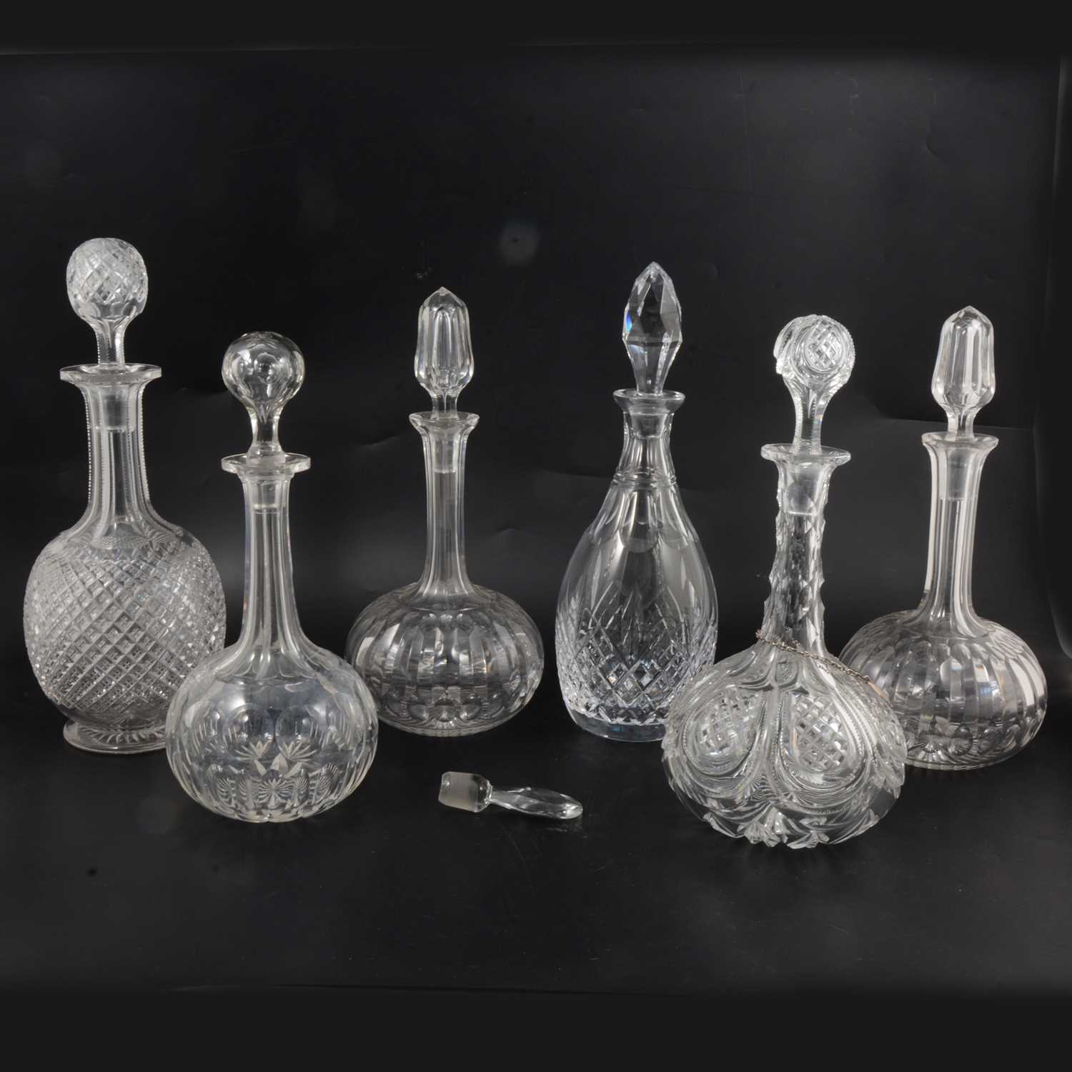 Lot 13 - Pair of cut glass globe and wand decanters and four others