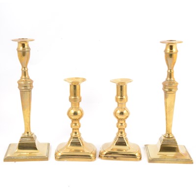 Lot 127 - Two pairs of brass candlesticks