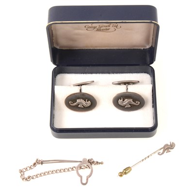 Lot 312 - Pair of silver seahorse cufflinks, similar tip pin and a silver tie bar.