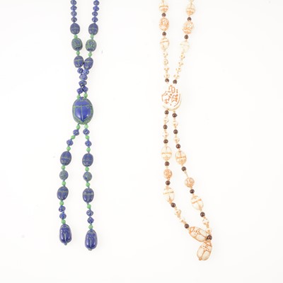 Lot 345 - Two Egyptian Revival pressed glass scarab bead sautoir necklaces, Tutankhamun inspired