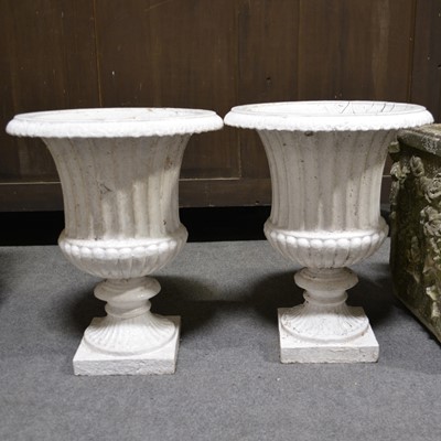 Lot 593 - Pair of cast iron garden urns