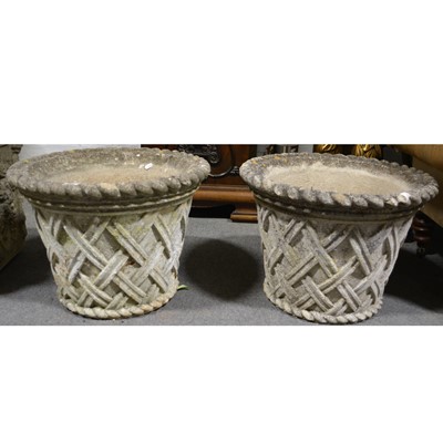 Lot 595 - Pair of cast concrete 'basket weave' garden planters.