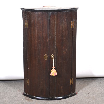 Lot 431 - George III oak hanging corner cupboard