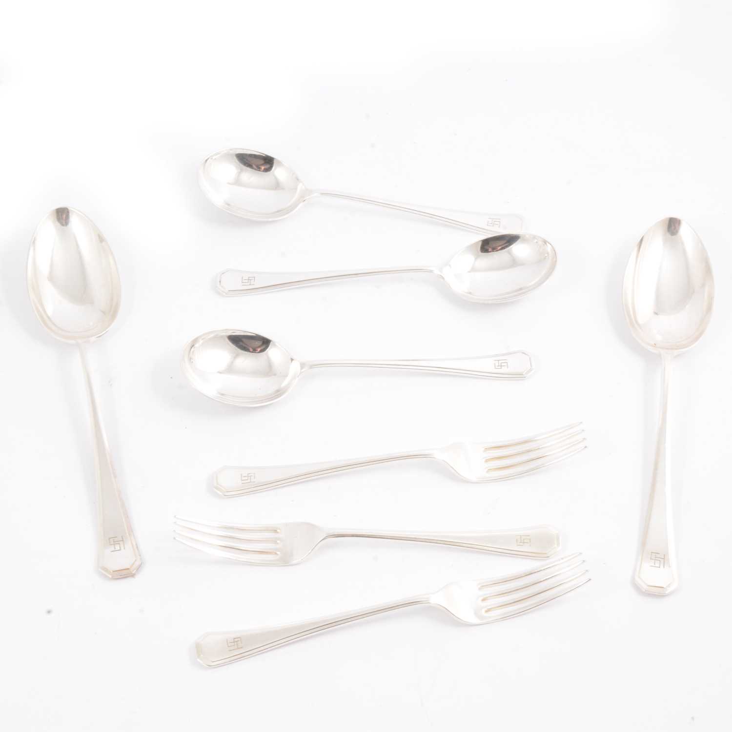 Lot 100 - A Maple & Co part canteen of electroplated cutlery with engraved monogram.