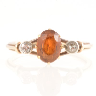 Lot 213 - Citrine and diamond three stone ring.