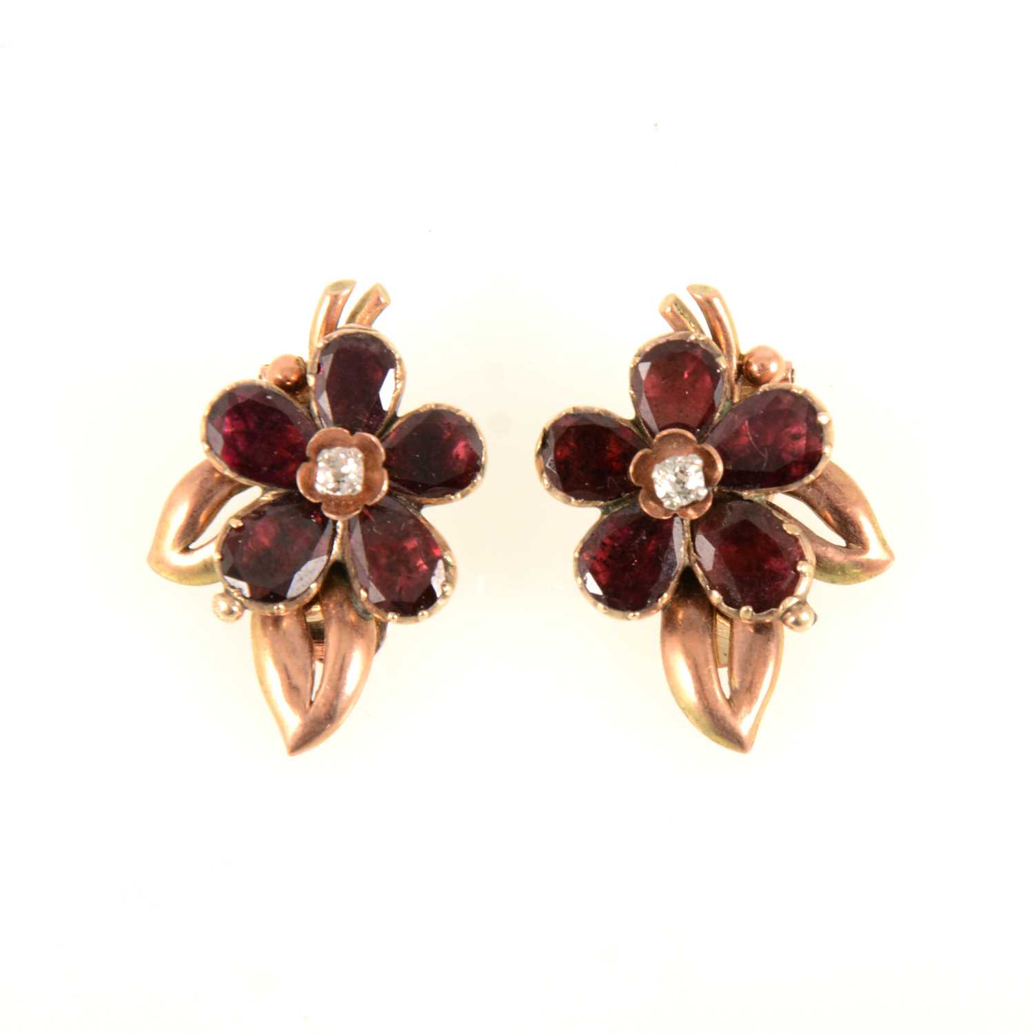 Lot 85 - A pair of garnet and diamond earclips.