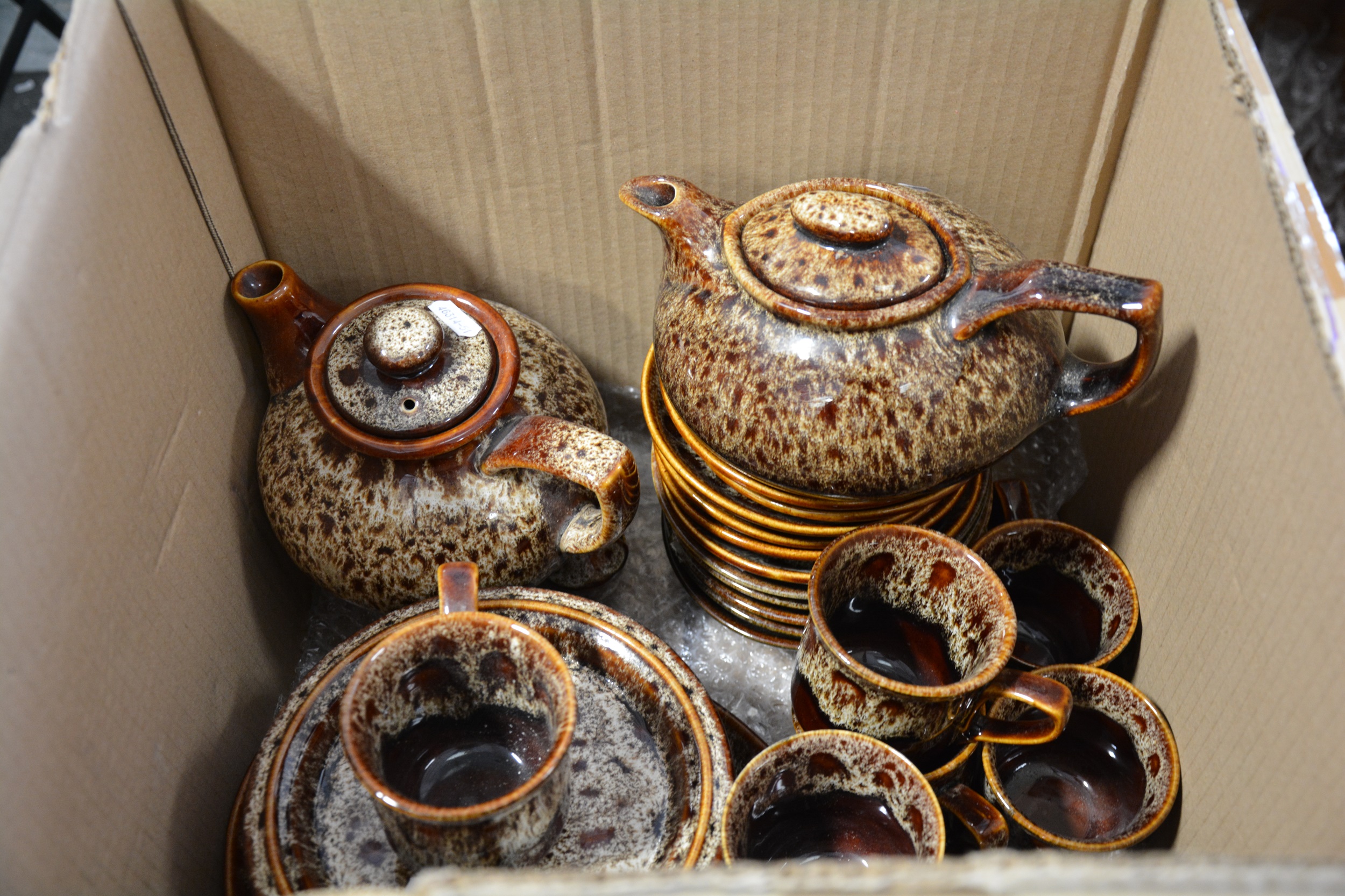 Lot 64 Fosters brown and treacleglazed tea sets.