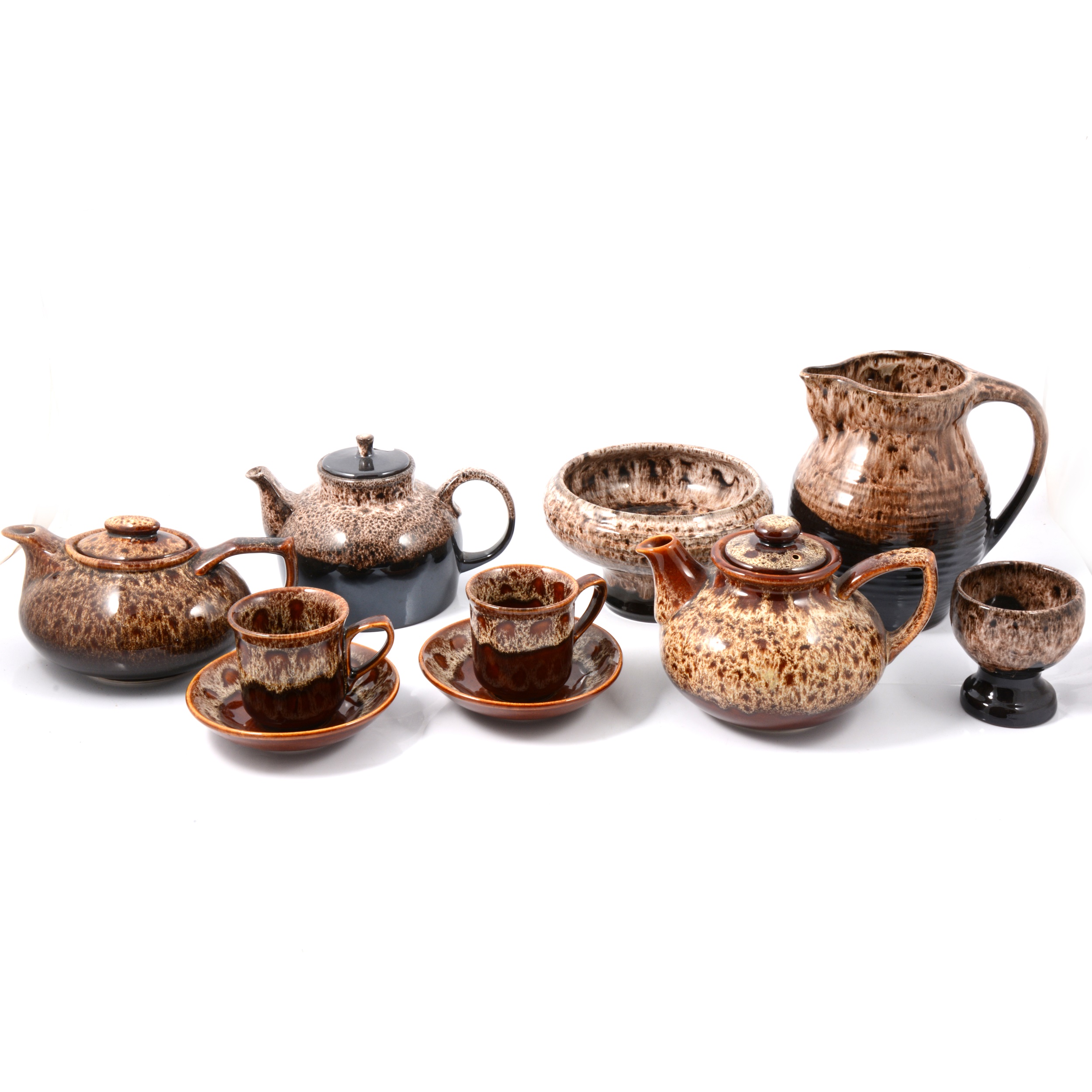 Lot 64 Fosters brown and treacleglazed tea sets.