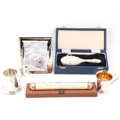 Lot 188 - Silver and plated christening gifts, birth certificate scroll, mugs, brush, new and boxed