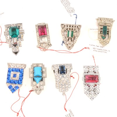 Lot 278 - Eight Art Deco clear and coloured paste single dress clips, 25-30mm