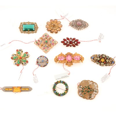 Lot 273 - Twelve vintage Czechoslovakian coloured paste brooches, circa 1930.