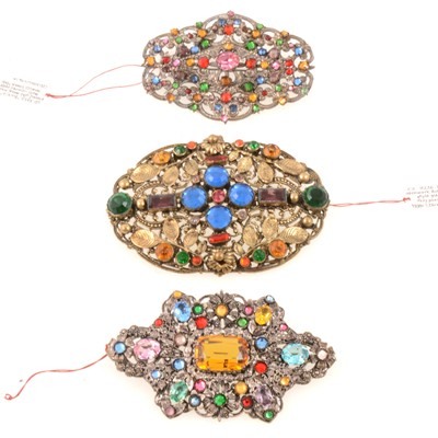 Lot 275 - Three large 1930's filigree brooches with coloured paste gems, Czechoslovakian.